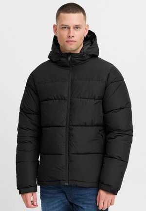 Black puffer jacket with a hood, featuring a zip closure, quilted design, and elastic cuffs. Smooth fabric with a matte finish.