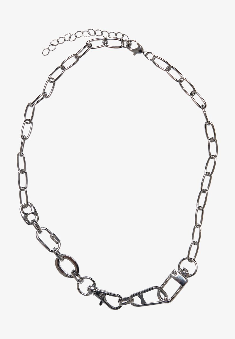 Metalliketju kaulakoru, jossa on pitkitetyt lenkit hopeanvärisestä metallista, jossa on rapukoukku ja säädettävä ketju takana pituuden vaihteluun.