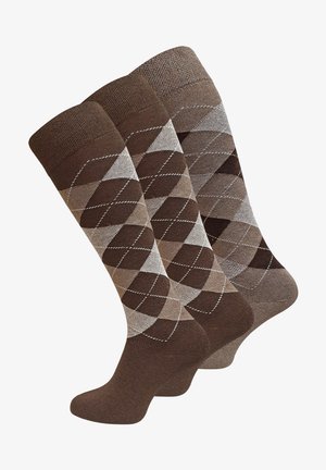 Calze marroni fino al ginocchio con un motivo a diamante in diverse tonalità di marrone e beige, con una parte superiore marrone uniforme e cuciture bianche sottili.