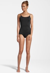 Black camisole top with thin straps, smooth texture, and fitted design, paired with matching black bikini bottoms. Simple and minimal.