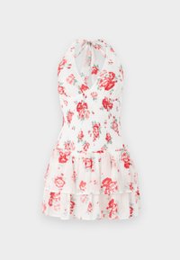 Floral halter dress featuring a white fabric with red and green flower patterns, smocked bodice, and layered ruffled hem.