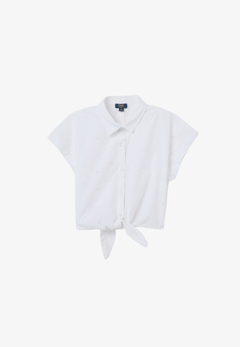 White short-sleeve shirt with a collar, featuring a tie front, textured dot pattern, and button closure.