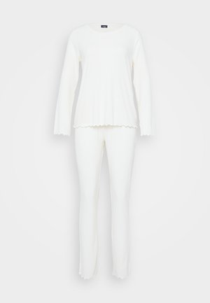 White ribbed long-sleeve top and matching pants set with scalloped edges on sleeves, hem, and pant legs on plain background.