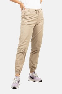 Pantalones beige de corte relajado, hechos de una tela ligera, con una cintura elástica y puños, bolsillos laterales y un detalle de cordón.