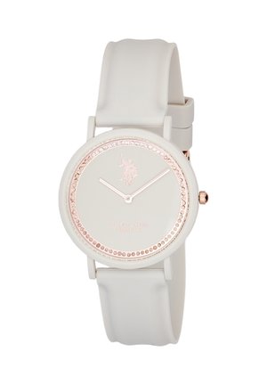 Orologio da polso con cinturino in silicone bianco e quadrante rotondo bianco, indici delle ore in rosa gold e logo e testo U.S. Polo Assn. sul quadrante.