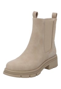 Bottine en suède beige avec une semelle épaisse, des panneaux latéraux élastiques et des accents de rhinestones décoratifs sur le talon. Texture lisse et bout arrondi.