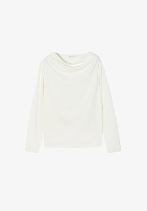 Pikkade varrukatega särk pehme valge kangaga, millel on rippuv kaelus. Omab sujuvat tekstuuri ja vabalt langevat lõiget.