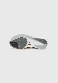 Black and white athletic shoe sole with textured grey rubber, featuring a Continental logo and an ADIZERO label.