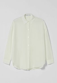 Light green, long-sleeve button-up shirt with a collar, straight hem, and fabric texture suggesting a lightweight, smooth material.