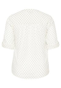 Blusa blanca con vista trasera, con mangas cortas arremangadas y una textura con un patrón de pequeños puntos negros a lo largo de la tela.