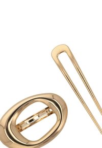 Set di accessori per capelli in oro composto da una clip ovale con finitura liscia e un lungo e sottile fermaglio per capelli. Superficie riflettente con design semplice.