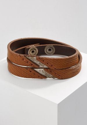 Brown leather double-wrap bracelet with metal Diesel logo accents and snap button closures, displayed on a white pedestal.