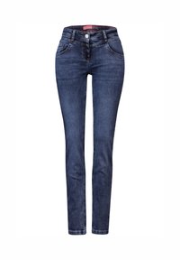 Jeans skinnys de denim azul oscuro con cintura alta, diseño tradicional de cinco bolsillos y una cremallera y botón visibles.