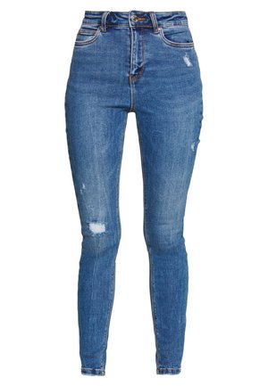 Jean skinny bleu taille haute avec des détails déchirés et un léger dégradé. Design classique à cinq poches avec passants de ceinture.