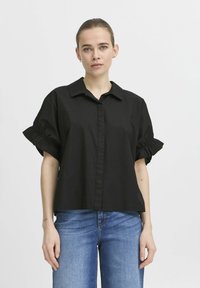 Black short-sleeve shirt with a collar and gathered detailing on sleeves. Made from lightweight fabric with a button-down front.