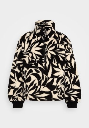 Juodas ir kremas fliso megztinis su aukštu apykakliu, pusiau užtrauktuku ir lapų raštu. Įrankių rankovės turi juodus elastingus juosteles, kad geriau priglustų.