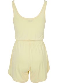 Gul uten ermer romper med elastisk midje, mykt stoff og avslappede shorts. Sømløse skuldre og minimale sømdetaljer.