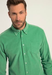 Groene button-up overhemd gemaakt van textuurstof, met een kraag, een borstzak en lichte knopen. Gladde afwerking met een casual pasvorm.