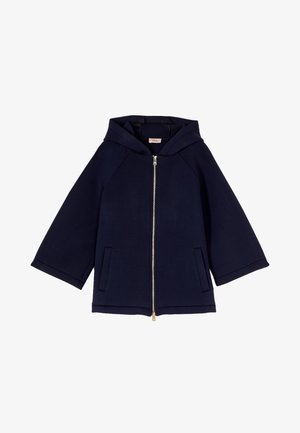 Laivastonsininen hupullinen takki, jossa etuvetoketju ja kaksi sivutaskua, neljäsosan pituiset hihat sekä rento istuvuus.