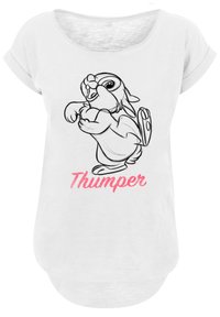 Hvit t-skjorte med kort erm som har en svart omrisset av en kanin og teksten "Thumper" i rosa under. Myk stoff, løs passform.