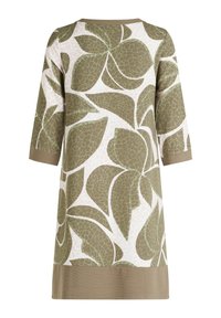 Grön och vit klänning med bladmönster, trekvartslånga ärmar, rund hals och enfärgad grön fåll. Tillverkad av lätt och mjukt tyg.