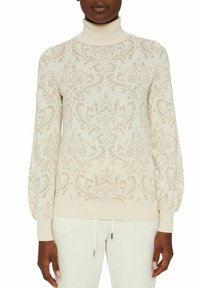 Krämsfärgad polotröja med ett intrikat tonalt damaskmönster, ribbstickade kanter och en avslappnad passform. Mjuk stickad material ökar komforten.