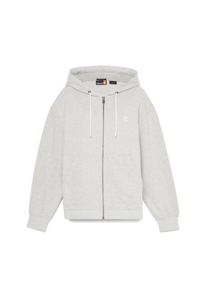 Grå zip-up hættejakke med snøre i hætte, kengurulommer og ribbede manchetter. Har et lille logo på venstre brystområde. Blødt stof.