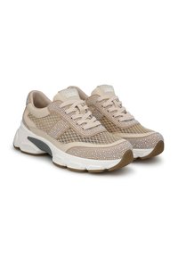 Beige athletic shoes with mesh and rhinestone accents, featuring a padded collar, lace-up front, and chunky white sole with gray details.