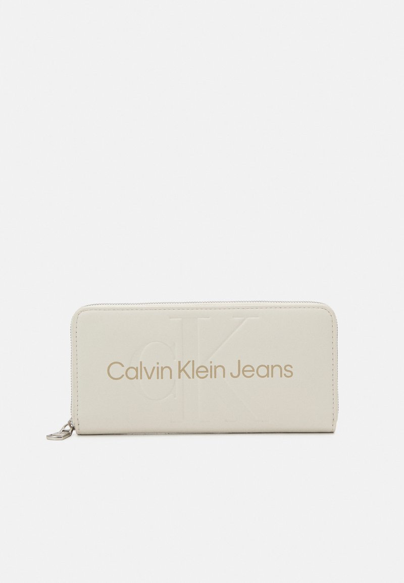 Calvin Klein Jeans - SCULPTED ZIP AROUND MONO - Wallet - eggshell, Enlarge