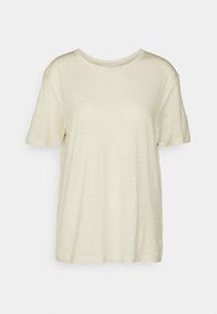 T-shirt corto a maniche corte di colore crema realizzato in un tessuto leggero. Presenta un collo rotondo e una vestibilità rilassata. Tessuto liscio, senza motivi visibili.