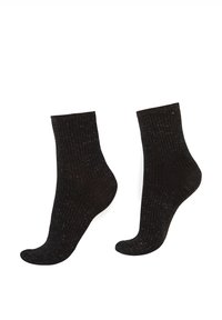 Schwarze gerippte Socken, knöchelhoch, aus strukturiertem Stoff gefertigt. Verfügen über einen dehnbaren Bund und eine nahtlose Zehenpartie für Komfort.
