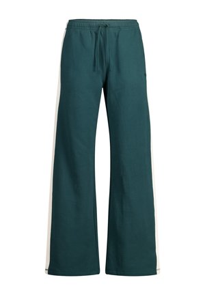 Pantalones de pierna ancha en color verde azulado con cinturilla ajustable; cuentan con rayas laterales en color blanco roto, una textura suave y un corte relajado.