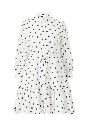 White long-sleeve button-up dress with black polka dots, a collar, a waist tie, and a ruffled hem.