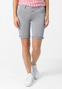 Gray denim shorts with rolled cuffs, featuring a standard five-pocket design and button closure, paired with white sneakers.