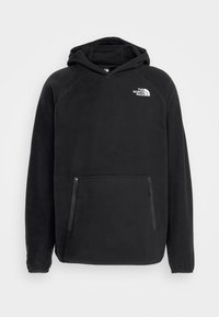 Hoodie in pile nero con tasca a marsupio, cappuccio regolabile e logo bianco del marchio sul petto. Tessuto morbido e maniche lunghe con polsini a costine.
