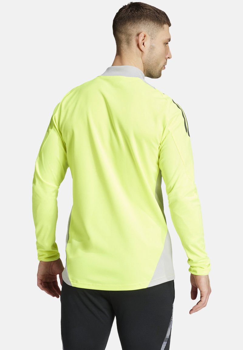 Langarmshirt in fluoreszierendem Gelb mit grauen Akzenten. Verfügt über einen klassischen Kragen und einen glatten, atmungsaktiven Stoff.
