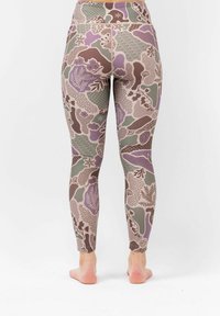 Tight-fitting leggings in a multi-colored floral pattern featuring shades of lavender, green, and brown on a light base, made from stretchy fabric.