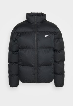 Black puffer jacket with high collar, zip closure, and Nike logo. Features quilted pattern and two side pockets.