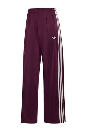 Pantaloni da corsa Adidas color marrone con vita elastica, tre strisce bianche laterali, tasca con zip e logo ricamato sulla coscia sinistra.