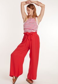 Cache Coeur PREGNANCY SAHEL - Stoffhose - coral