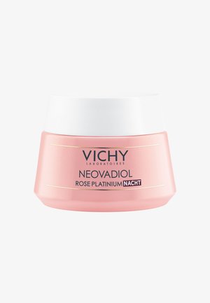 Pink cream jar with a white lid, featuring a smooth, matte texture. Label reads "NEOVADIOL ROSE PLATINIUM NACHT" in elegant typography.