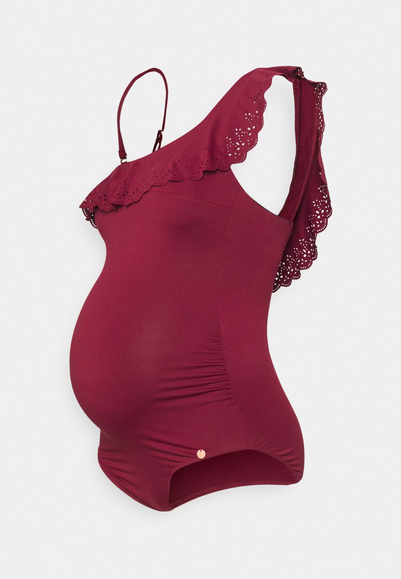 Maillot de bain de maternité bordeaux, avec un décolleté festonné, des bretelles réglables et un ruché sur les côtés pour une silhouette ajustée.