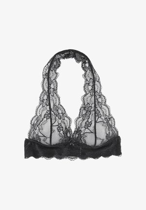 Bralette en dentelle florale noire avec des bords festonnés, design à col halter et tissu transparent.