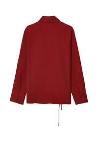 Camicia a maniche lunghe color bordeaux con colletto, dotata di polsini con bottoni e taglio dritto. Tessuto morbido con leggero lucido. Coulisse all'orlo.