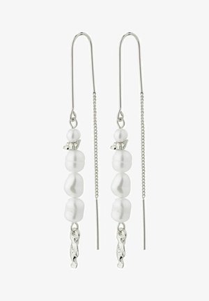 Silver earrings featuring two elongated hooks. Decorative white pearls arranged vertically with a small silver accent on top.
