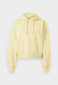 Ανοιχτό κίτρινο cropped hoodie με κορδόνια, ριχτές μανσέτες και στρίφωμα, και λευκό κείμενο "Tommy Hilfiger EST. 1985" στο στήθος.
