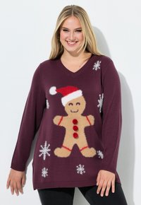 Suéter de punto color ciruela con cuello en V, que presenta un diseño de un hombre de jengibre con un gorro de Santa y pompones rojos, adornado con copos de nieve blancos.