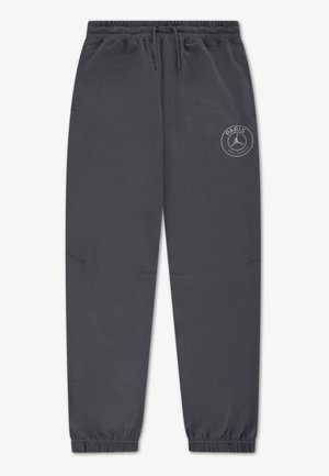 Pantalon de jogging gris foncé avec taille et poignets élastiques, cordon de serrage, poches latérales, et logo Paris Saint-Germain sur la cuisse droite.