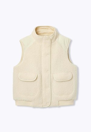 Gilet en polaire de couleur crème avec un col haut, fermeture à pression et deux poches avant. Présente une surface douce et texturée ainsi qu'un ourlet côtelé.
