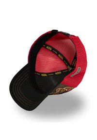 Red and black Von Dutch trucker cap with mesh back, stitched brim, and branded interior band, shown from inside and tilted angle.